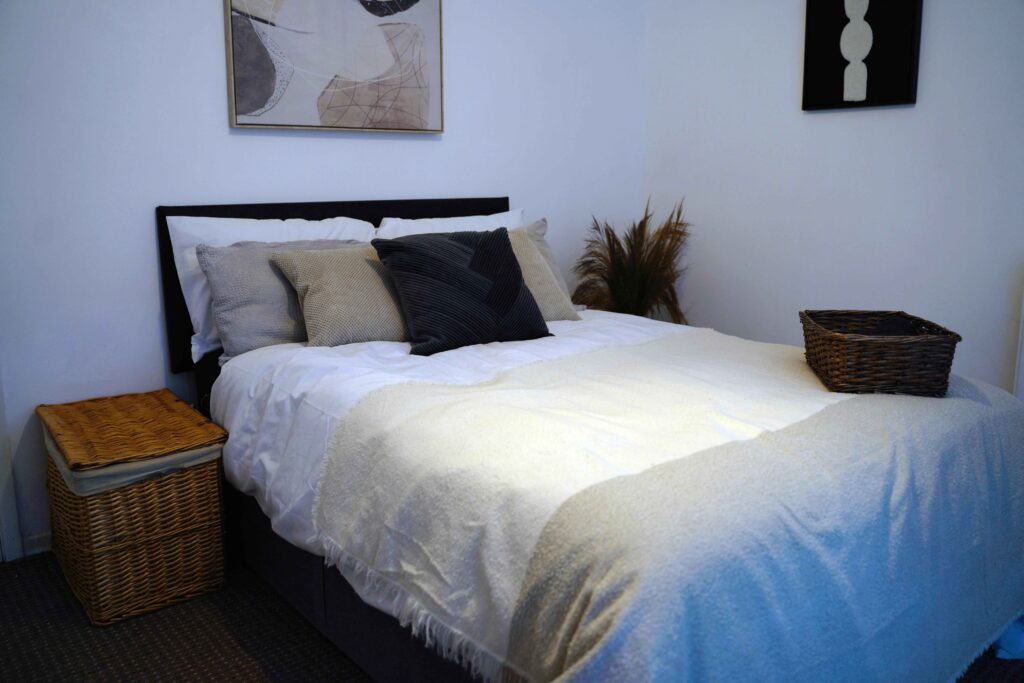 neutral bedroom with layered textures and affordable decor